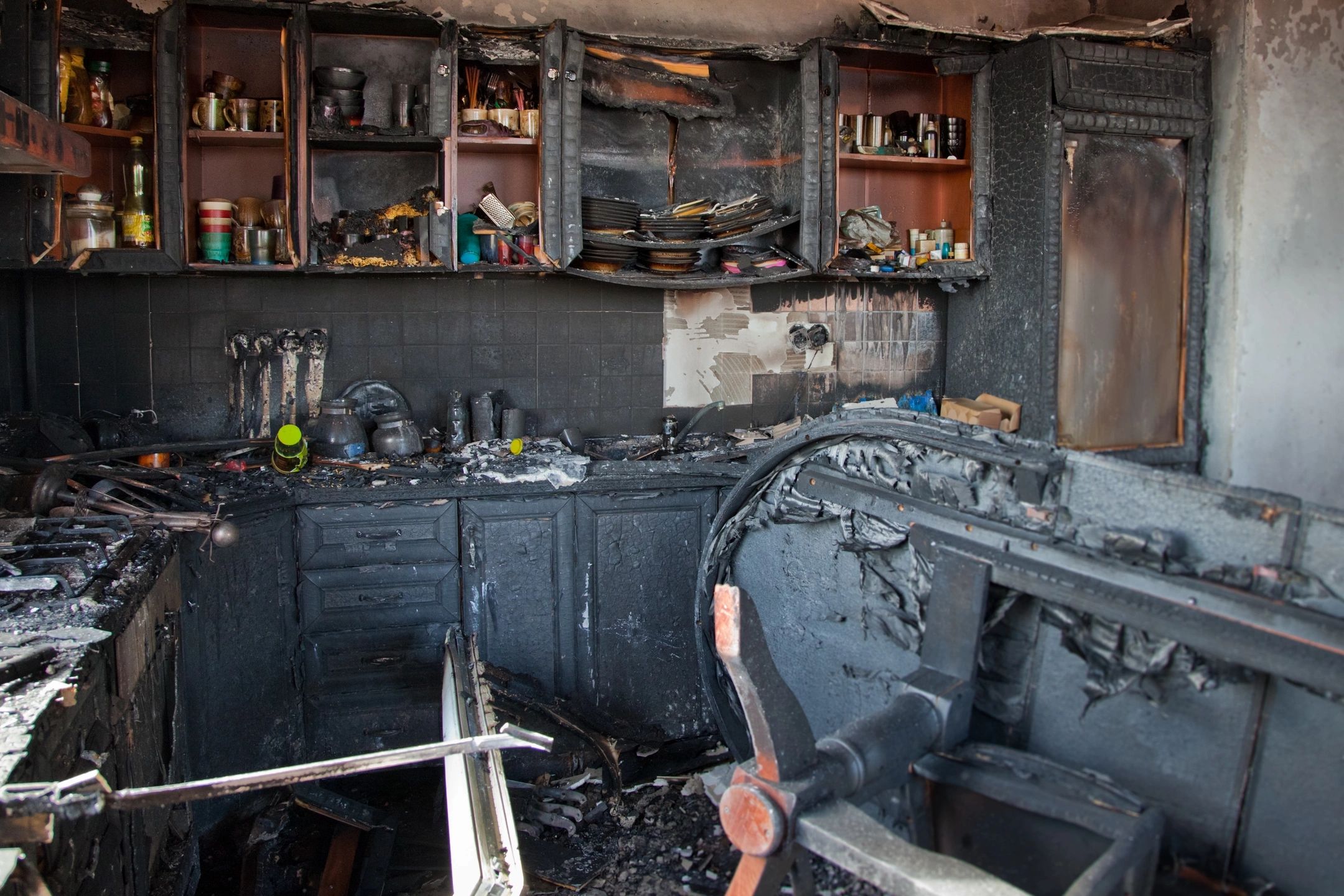 fm=f_43087 A kitchen with black paint and fire damage.